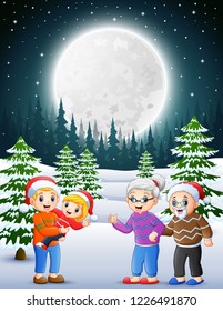 Happy family in the snowy garden at night