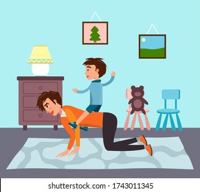 Happy family spending time together at home. Father riding his son at back standing like horse. Happy kid playing with dad. Concept of parenthood, relations between children and parents. Single father