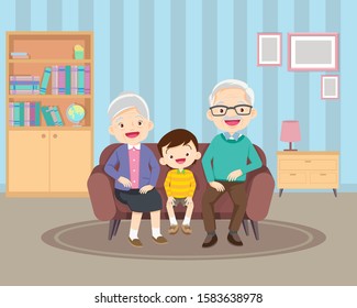 Happy family whith grandchildrens and grandparents sitting on the sofa.