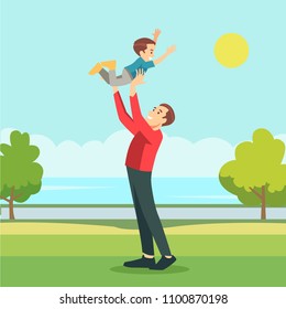 Happy father playing with his son in outside in garden