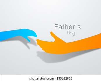 Happy Fathers Day background with a father and child hands on grey background.