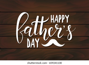 Happy Father's day handwritten lettering on dark wooden planks background