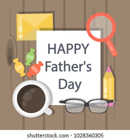 Happy father's day. Table with greeting card.