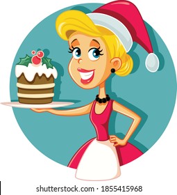 Happy Female Home Cook Holding Christmas Cake. Cheerful Baker creating a holiday desert specialty
