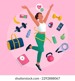 Happy fit woman exercising and measuring her waist, she is surrounded by workout equipment