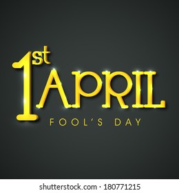 Happy Fool's Day funky concept with golden text on grey background.