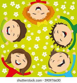 Happy friends lying on the grass with flowers