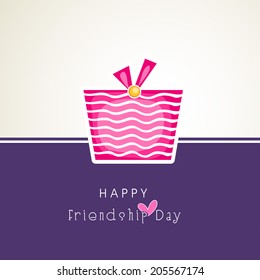 Happy Friendship Day celebrations greeting card design with pink gift box on beige and purple background. 