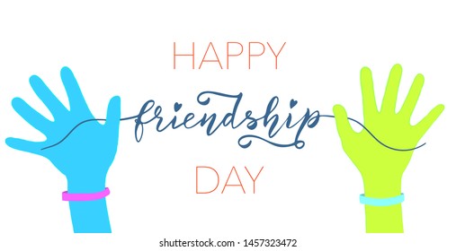 Happy Friendship Day Lettering Concept. Two Friends' Hands Holding Lettering and rubber bracelets. 
