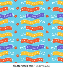 Happy friendship day seamless pattern. Friendship bracelets on blue background vector flat illustration. Three wristbands with congratulatory title