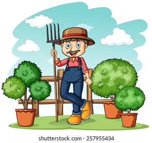 Happy gardener holding a rake on a white background