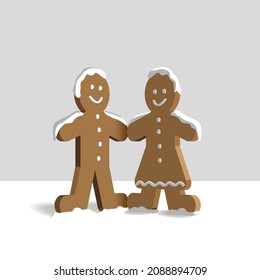 Happy Gingerbread couple in snow. Christmas traditional cookie.