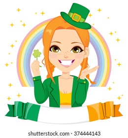 Happy girl dressed as leprechaun celebrating Saint Patrick day holding luck green clover shamrock