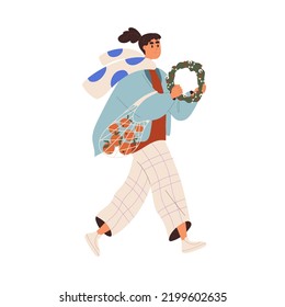 Happy girl going with shopping tote bag, Christmas wreath. Young woman carrying fruits, ornament, preparing for winter holiday at Xmas eve. Flat vector illustration isolated on white background