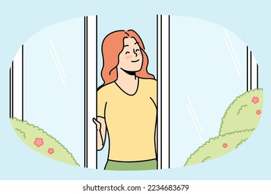 Happy girl looks out of window, rejoices in rays of sun, flowering vegetation in spring outside. Young woman enjoying summer sunny day standing in open door. Vector thin line isolated illustration.