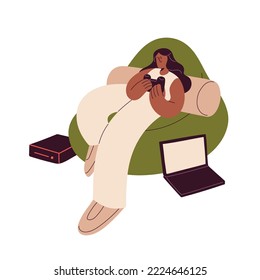 Happy girl playing console. Young black woman relaxing in chair, holding joystick for video game in hands. Gamer player resting at leisure time. Flat vector illustration isolated on white background