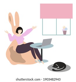 Happy girl sitting barefoot in rabbit puff in front of her laptop at home. Hands up. She is working remotely, talking to someone or shopping online. Cute black cat sleeps nearby. Cozy, minimal, flat.