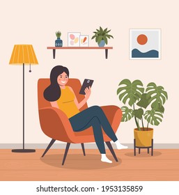 Happy girl sitting on the chair with tablet. Vector flat illustration