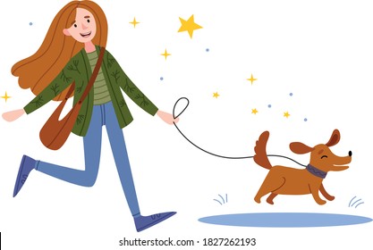 A happy girl walks the dog. The dog jumps into a puddle. woman playing with her dog in the park.