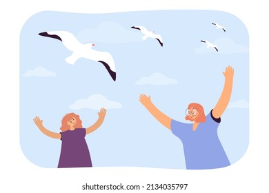 Happy girls looking at seagulls in sky flat vector illustration. Smiling friends raising hands, spending summer vacation at sea. Travel, trip concept for banner, website design or landing web page