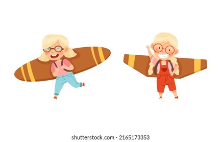 Happy girls playing with cardboard toy plane wings cartoon vector illustration