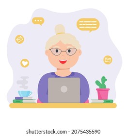 Happy grandma with laptop. Old woman using computer to communicate on the internet