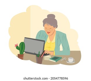 Happy grandmother with laptop. An elderly woman is studying modern technologies using a laptop. A positively smiling grandmother sits at a computer, communicates on the Internet online, works online.