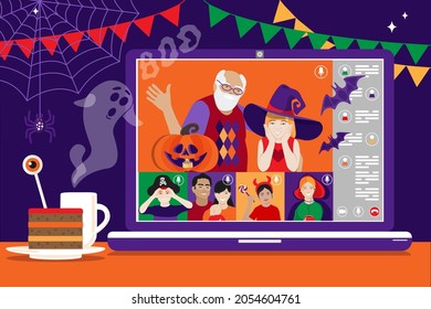 Happy grandpa with granddaughter in Halloween witch costume having video chat on laptop with friends at home. Online virtual Halloween party. Traditional Trick or treat autumn holiday scary decoration