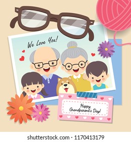 Happy Grandparent's Day. Photo Of Cute Cartoon Grandparents & Grandchildren. Photo Frame With Flowers, Eyeglasses, Yarn Ball And Memo Written 