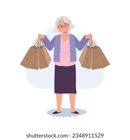 Happy Granny Holding Shopping Bags. Elderly Woman Enjoying Shopping with Shopping Bags.  Senior Lifestyle and Retail Therapy