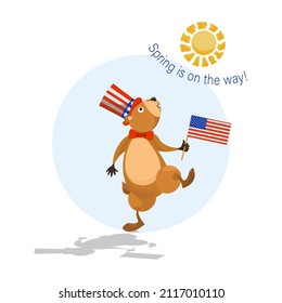 Happy Groundhog Day. Cute groundhog in a hat and an American flag marches merrily towards spring. 