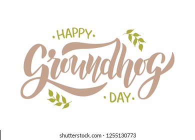 Happy Groundhog Day - hand drawn brush lettering with leaves on beige background. For poster, invitation, card, flyer, advertising, web. Vector illustration.