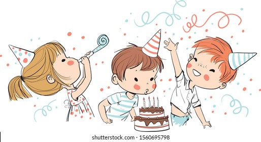 Happy group of children having fun at birthday party.  Child blows out candles on cake.