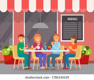 Happy Group Of Friends Eating Fast Food, Sitting In Outdoors Cafe, Burger, Hot Dog, French Fries, Soda. Group Of People Spend Leisure Time Together In Cafeteria. Girls Guys Enjoy Of Rest. Time To Eat