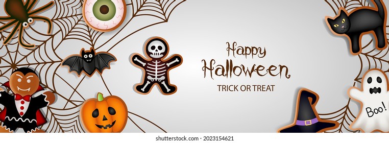 happy halloween banner with gingerbread cookies and spiderwebs