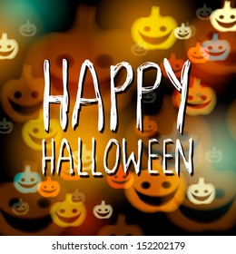 Happy Halloween card on the background with bokeh pumpkins