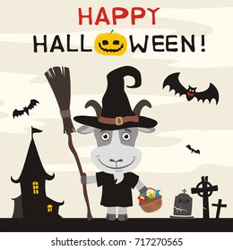 Happy Halloween! Goat in witch hat and with broom on background of terrible home and cemetery.