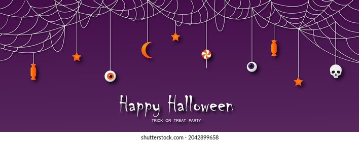 Happy Halloween greeting card in paper cut style. Candy, skull, stars and moon hanging on a cobweb on a purple background. Vector illustration.