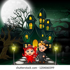 Happy halloween kids in front of the haunted house with full moon background