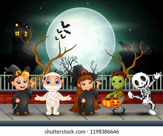 Happy halloween kids in full moon background
