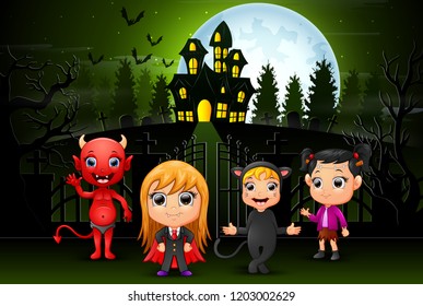 Happy halloween kids outdoors with haunted house background
