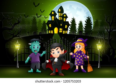 Happy halloween kids outdoors with haunted house background