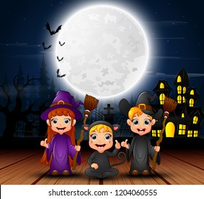 Happy halloween kids with scary house and full moon in the night