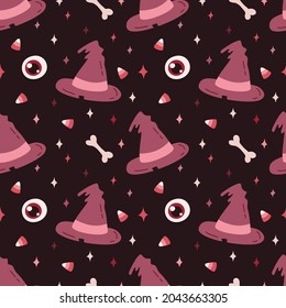 Happy Halloween. Seamless pattern. Cute vector illustration with little pink hat, bone, eye, candy and stars on brown background.