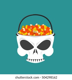 Happy halloween skull basket candy corn. Trick or treat. Sweets for terrible holiday. Horrible skeleton basket for sweets
