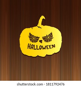 Happy Halloween text Banner or poster background. Vector golden halloween label with scary pumpkin isolated on wooden background