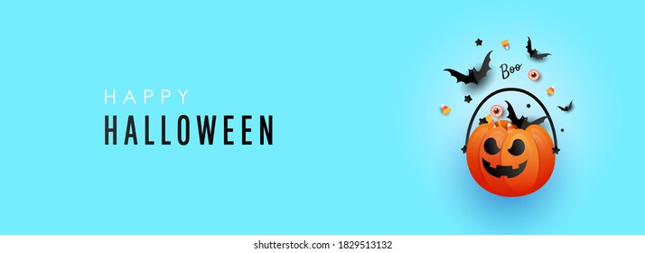 Happy Halloween trend horizontal banner with pumpkin decorations with striped candy and a bat on a blue background