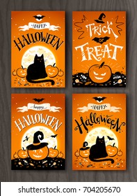 Happy Halloween and Trick or Treat postcards designs set on wood background.