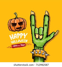 Happy halloween vector greeting card with rock n roll gesture green monster zombie hand and hand drawn calligraphic text on orange background. vector hand drawn halloween design elements set
