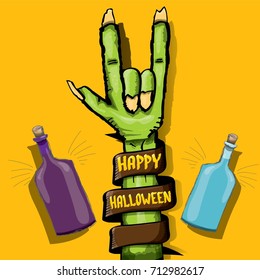 Happy halloween vector greeting card with rock n roll gesture green monster zombie hand and hand drawn calligraphic text on orange background. vector hand drawn halloween design elements set
